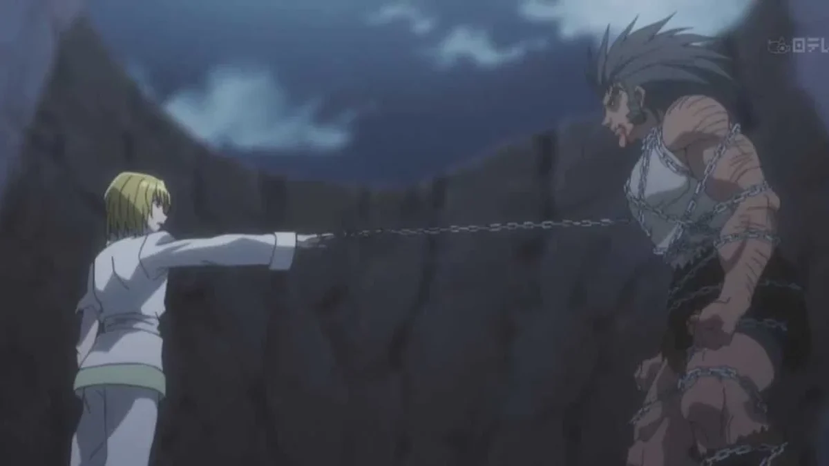 Kurapika usa uma corrente contra Uvogin durante o confronto em Yorknew
